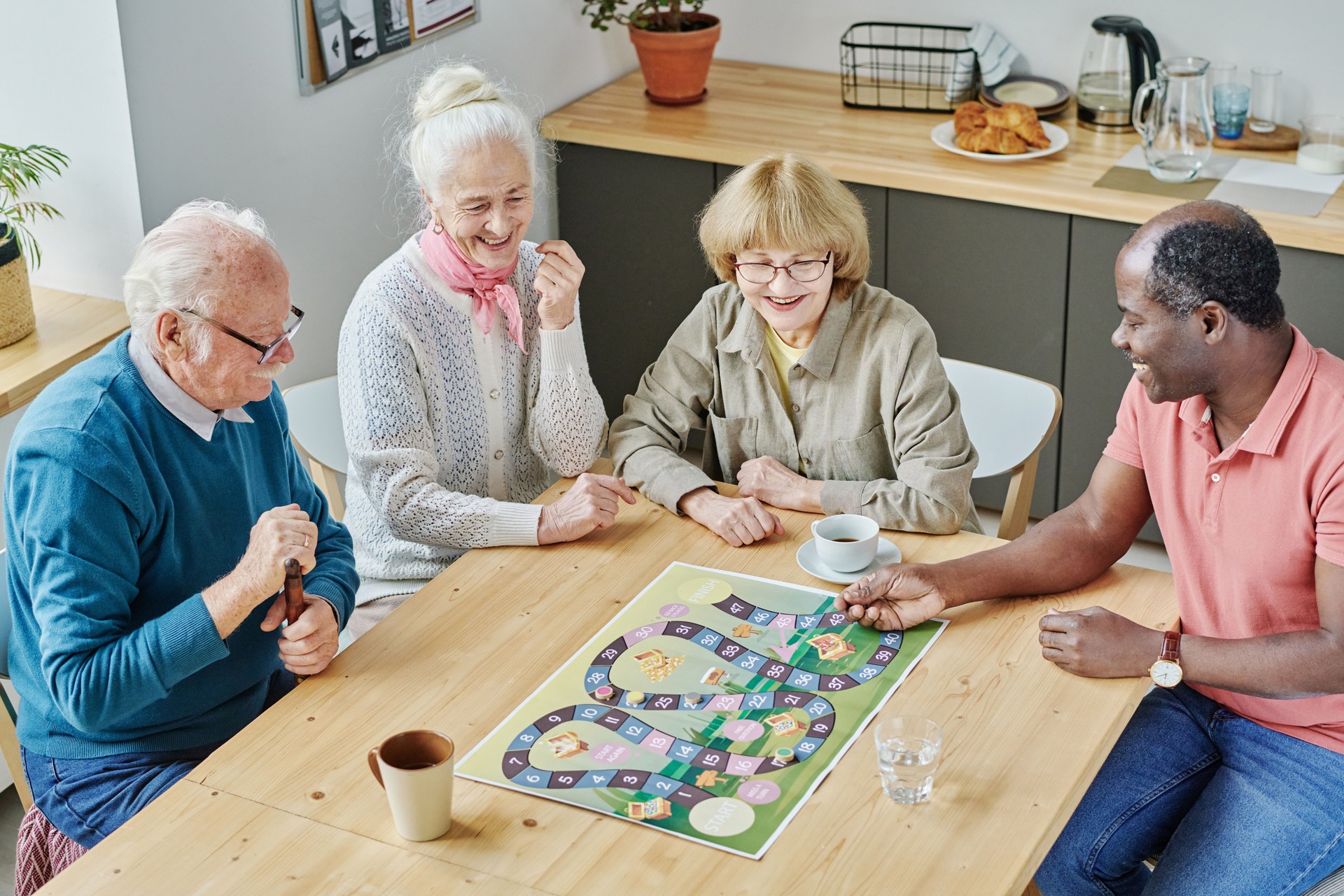 Senior friends playing board game